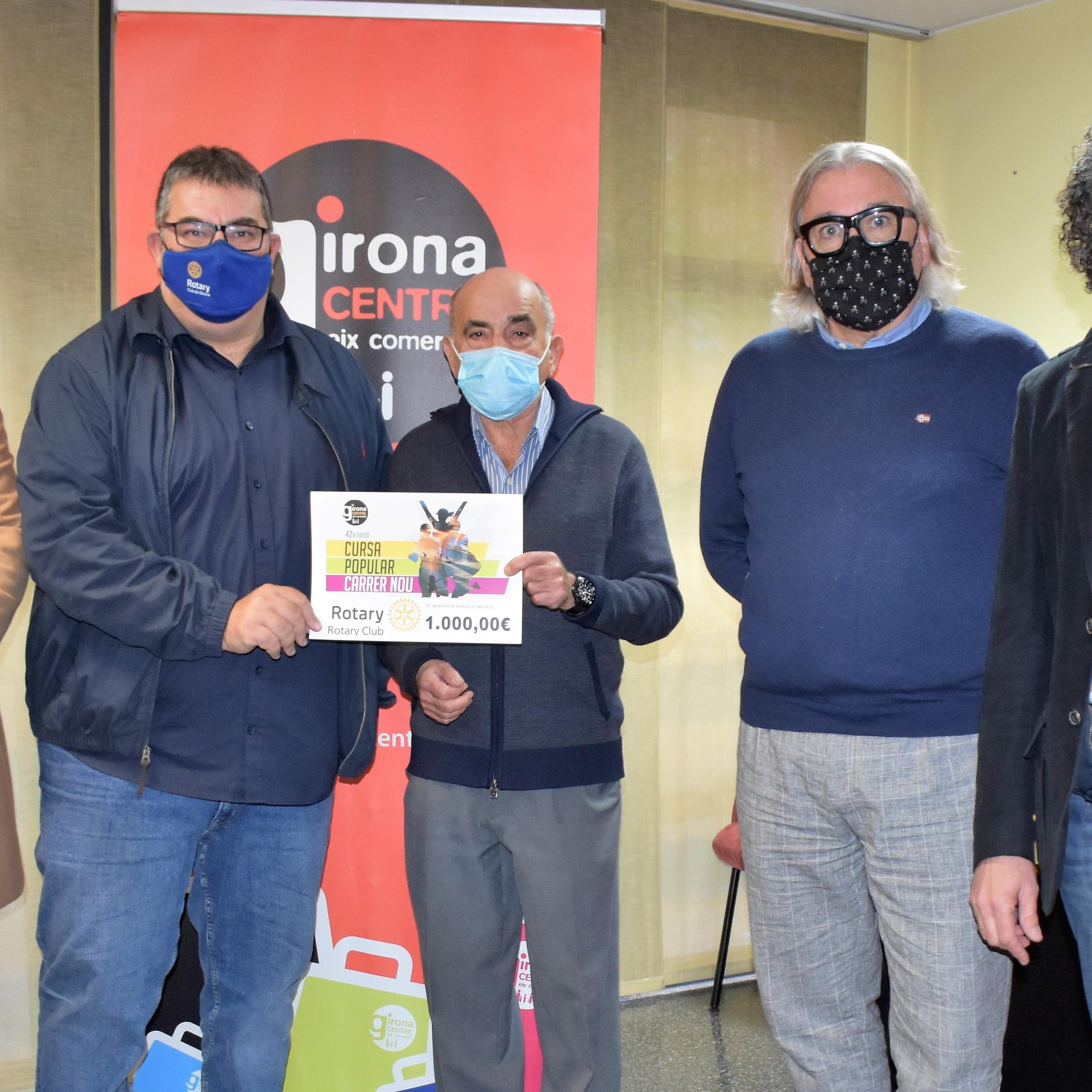 Donació de la cursa popular del Carrer Nou al Rotary Club de Girona