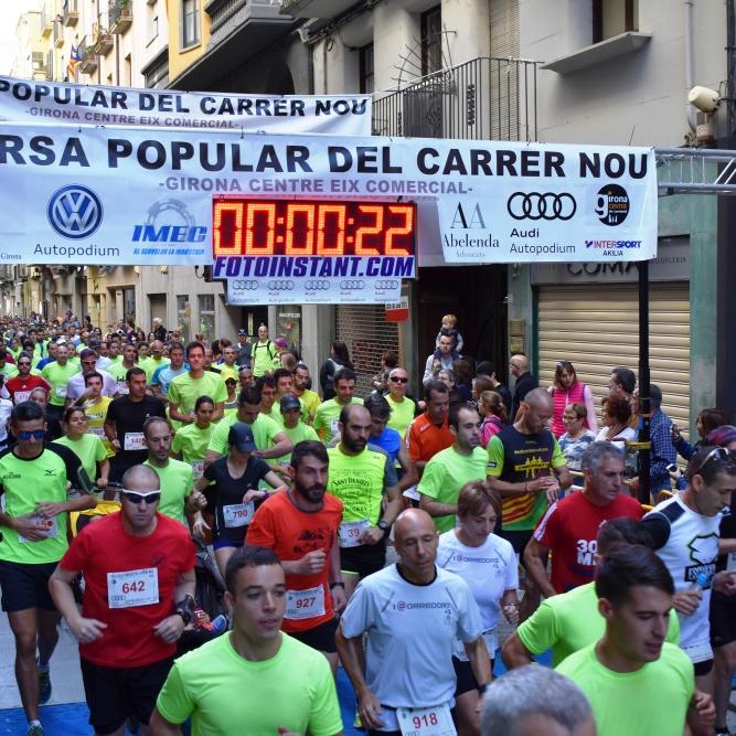 La Cursa Popular del Carrer Nou omple la ciutat de samarretes verdes a favor de Catalunya Contra el Càncer-Girona i del Rotary Club