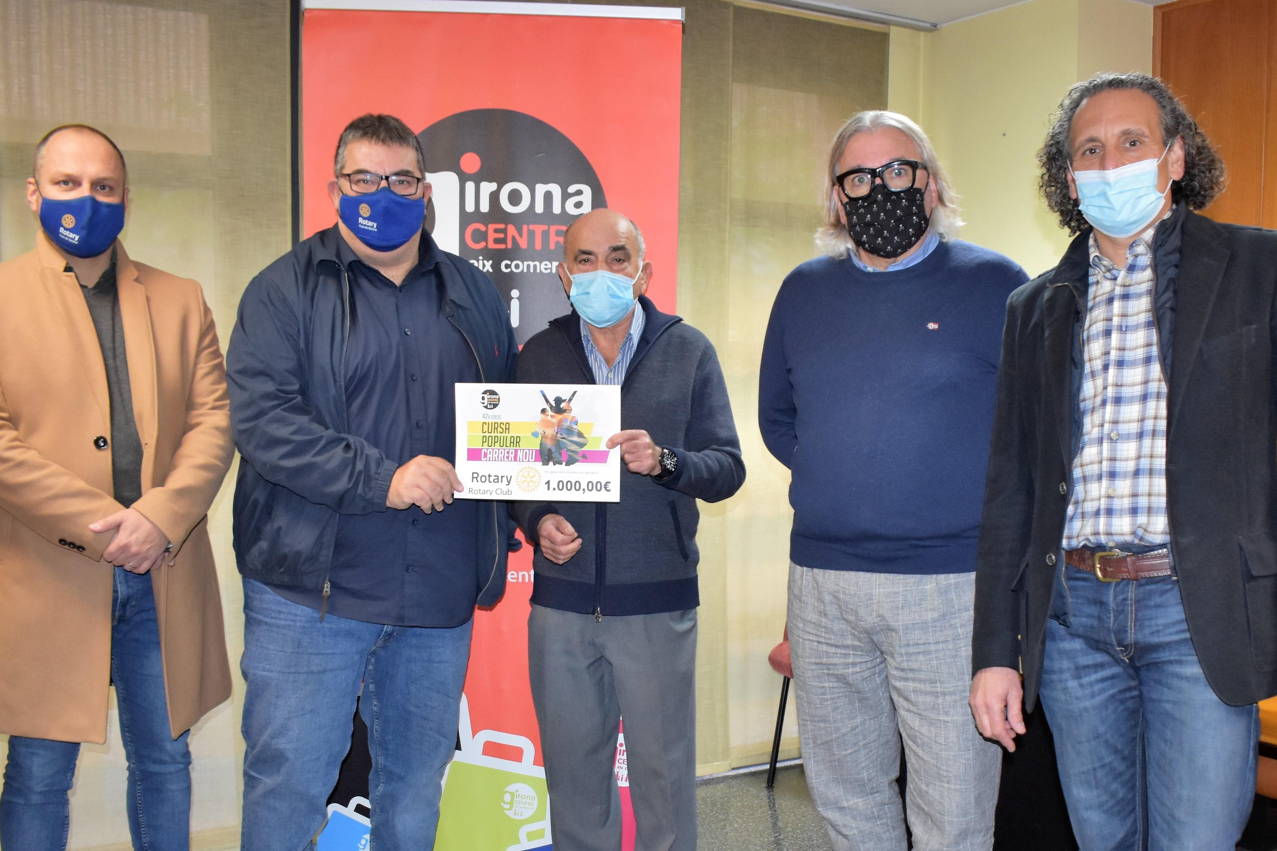 Donació de la cursa popular del Carrer Nou al Rotary Club de Girona